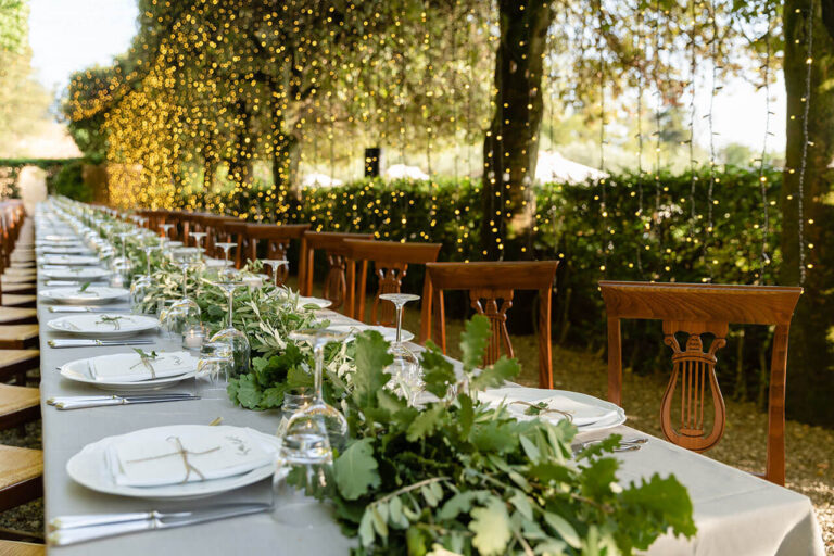 details of wedding table under a tunnel of lights